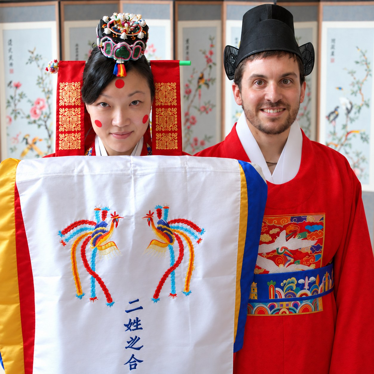 Brandon and his wife in traditional Korean wedding attire